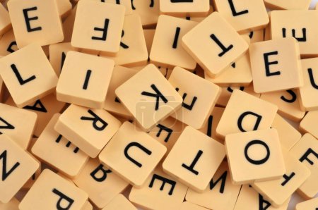 Foto de Letters of a Scrabble game shuffled close-up - Imagen libre de derechos