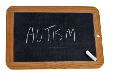 Photo for School slate on which is written autism with chalk - Royalty Free Image