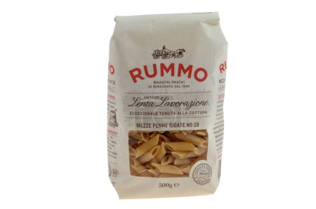 Photo for Packet of Rummo brand penne rigate pasta close up on white background - Royalty Free Image