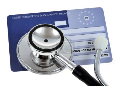 Photo for Stethoscope lying on a European health insurance card close up on a white background - Royalty Free Image