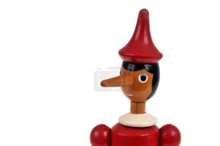 Photo for Close-up portrait of wooden Pinocchio puppet on white background - Royalty Free Image