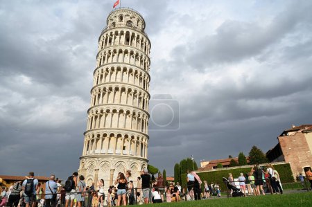 Photo for Tourists in front of the Tower of Pisa in Tuscany - Royalty Free Image
