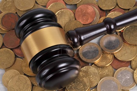 Judge gavel on a background of euro coins