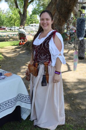 Photo for 4-15-2023: Visalia, California: Vendors and art in period costumes at a Renaissance Faire - Royalty Free Image
