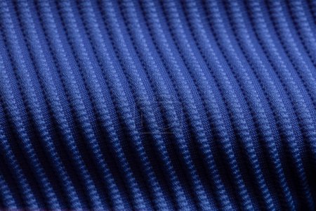 Closeup of blue corduroy cloth as patterned textured background for design purpose