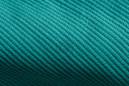 Closeup of green corduroy cloth as patterned textured background for design purpose