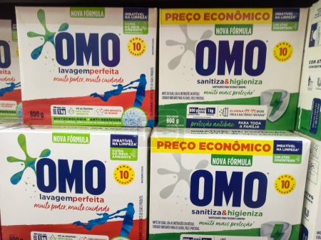 Photo for RIO DE JANEIRO, BRAZIL - April 20, 2024: Boxes of OMO washing powder on the supermarket shelf. The brand belongs to the multinational Unilever. Close up - Royalty Free Image