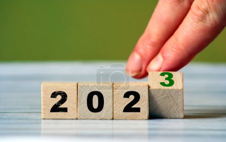 2023 change year concept. Cube block with 2023 inscription as start New Year 2023. start new business target strategy concept. Loading year concept