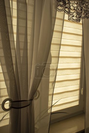 Photo for Day-night blinds in a cozy indoor room near the window. - Royalty Free Image