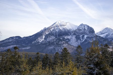 Photo for "Panoramic snowy Tatra peaks in winter with a clear sky backdrop" - Royalty Free Image