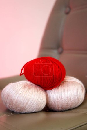 Photo for Balls of woolen threads and knitwear - Royalty Free Image