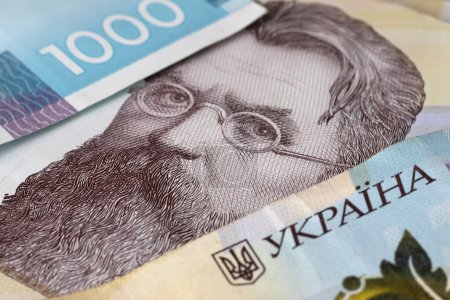 Téléchargez les photos : Image of Ukrainian banknotes lying in disarray - en image libre de droit