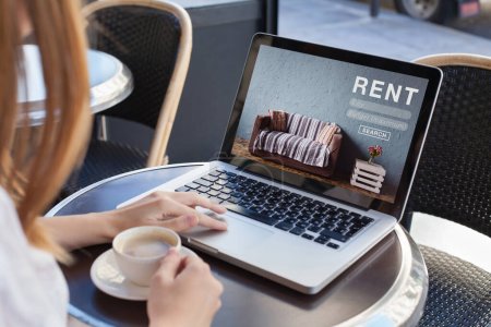 Photo for Rent online concept, woman using internet website for rental apartments, houses and flats - Royalty Free Image