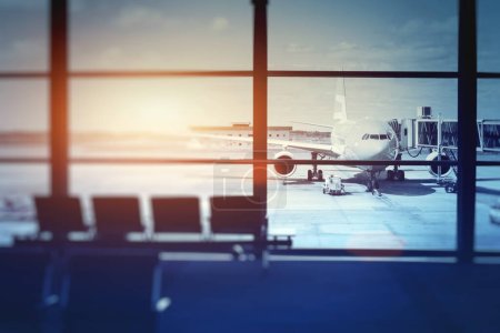 Photo for Airplane waiting for departure in airport terminal, blurred horizontal background with place for text - Royalty Free Image