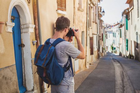 Photo for Tourist travel photographer taking photo of the street with dslr camera, photography point of view - Royalty Free Image