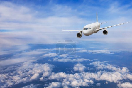 Photo for Airplane flying above the clouds, travel concept, aircraft jet plane in blue sky - Royalty Free Image
