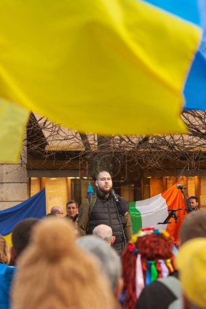 Photo for Dublin, Co. Dublin, Ireland - February 24th 2023 - Ukrainians and supporters rally. The first anniversary of Russia's invasion of Ukraine. O'Connell street near GPO. Speech of Ukrainian warrior. Text space - Royalty Free Image