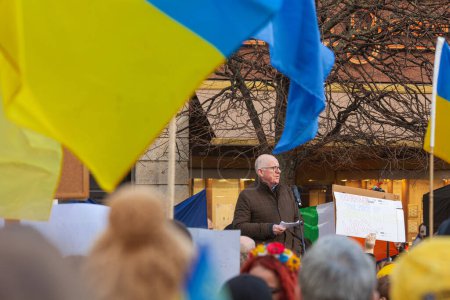 Photo for Dublin, Co. Dublin, Ireland - February 24th 2023 - Ukrainians and supporters rally. The first anniversary of Russia's invasion of Ukraine. O'Connell street near GPO. Speech of Charles Flanagan, Committee of Defence - Royalty Free Image