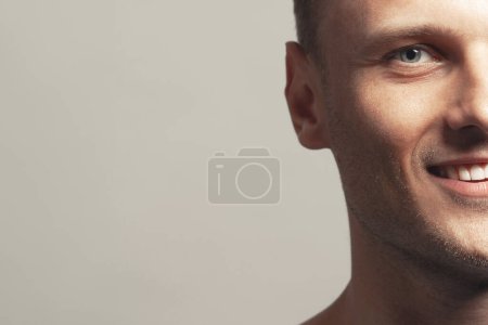 Photo for Male beauty concept. Portrait of handsome 30-year-old man with blue eyes posing over gray background. Close up. Classic style. Shiny white smile. Headshot. Studio shot - Royalty Free Image