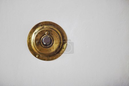 Photo for Who is there concept. Old style peephole in white door. Close up. Copy space. Indoor shot - Royalty Free Image