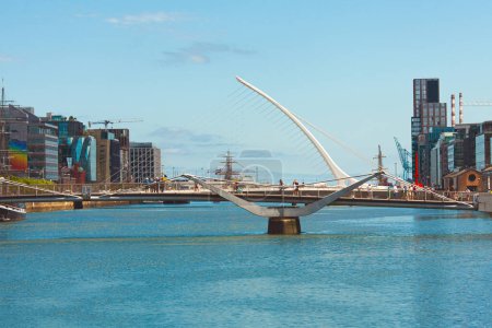 Photo for Discovering Ireland concept. A view to Samuel Beckett Bridge over River Liffey in Dublin city. Sunny day. Text space. Outdoor shot - Royalty Free Image