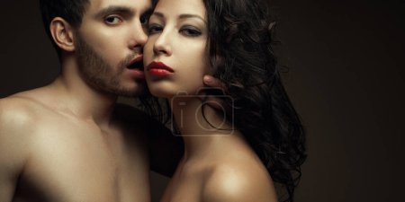 Photo for Aroma of pure passion concept. Emotive portrait of two lovers over chocolate background - handsome man and gorgeous woman with perfect hair and skin. Close up. Copy-space. Banner style. Studio shot - Royalty Free Image