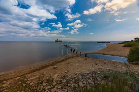 Photo for Gdynia, Poland - July 24 2023: Babie Doly beach with old ruins of pier and ruins of torpedo room on the Baltic sea - Royalty Free Image