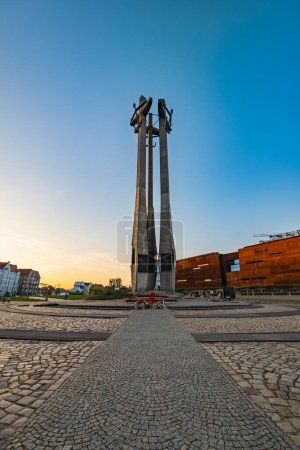 Photo for Gdansk, Poland - September 7 2023: Beautiful and high monument to the Fallen Shipyard Workers 1970 standing in front of European Solidarity Center building at shipyard - Royalty Free Image