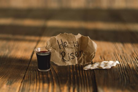 Photo for He is risen. Communion. Religious tradition of breaking bread. Bread and wine as a sign of memory of Christs sacrifice. - Royalty Free Image
