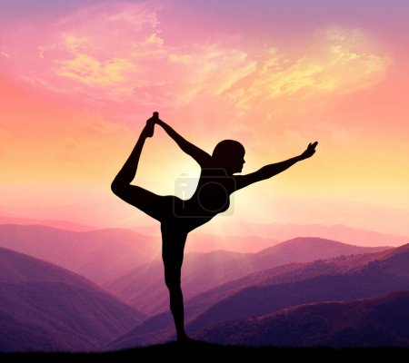 Photo for A woman practices yoga on a background of mountains and sky. Healthy lifestyle concept. - Royalty Free Image