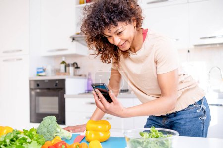 Photo for Happy black woman ordering online ingredient meal recipe - Royalty Free Image
