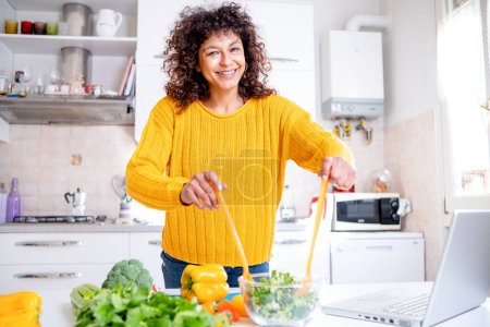 Photo for Black woman preparing salad. Healthy eating concept - Royalty Free Image