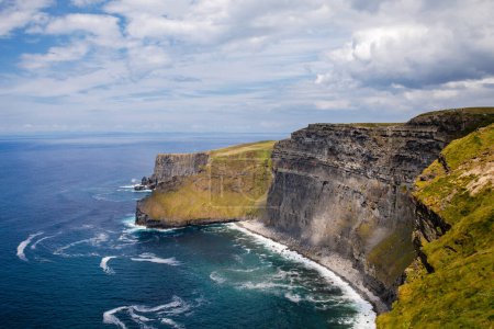 Photo for Spectacular Cliffs of Moher are sea cliffs located at the southwestern edge of the Burren region in County Clare, Ireland. Wild Atlantic way. - Royalty Free Image
