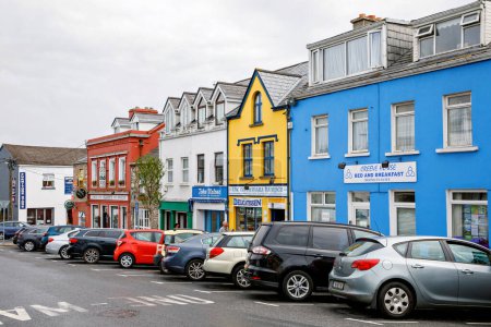 Photo for CLIFDEN, IRELAND - 16 July, 2019: Awesome and colorful streets of Clifden, Connemara, Ireland. Colourful houses, doors, pubs, windows with flowers - Royalty Free Image
