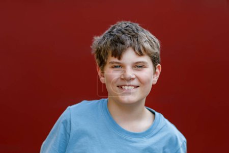 Photo for Portrait of positive preteen school kid boy. Beautiful happy child looking at the camera. Schoolboy smiling - Royalty Free Image