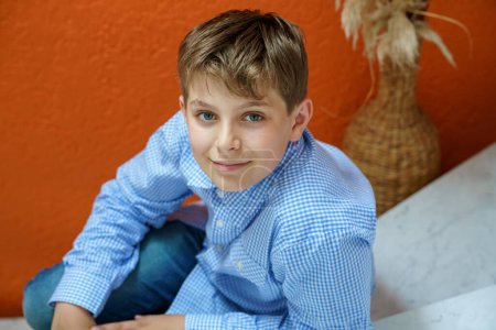 Photo for Handsome Teenager Boy Poses Indoors, Exuding Confidence and Style in a Captivating Portrait. Happy Preteen Child - Royalty Free Image
