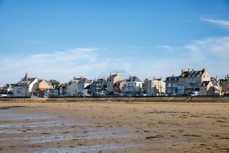 Photo for View of coastal street of Grandcamp Maisy, a scenic French coastal town in Normandy, with fishing port, sandy beaches, and maritime traditions - Royalty Free Image