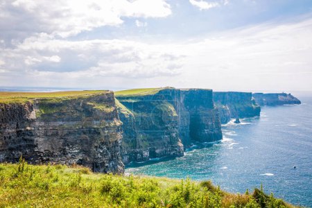 Spectacular Cliffs of Moher are sea cliffs located at the southwestern edge of the Burren region in County Clare, Ireland. Wild Atlantic way.