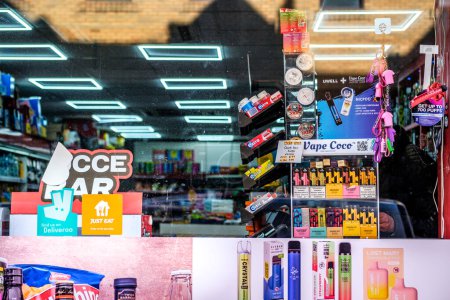 Photo for Kingston-Upon-Thames, London UK, February 12 2024, Independent Corner Shop or Mini-Market Selling Vapes and assorted Products - Royalty Free Image