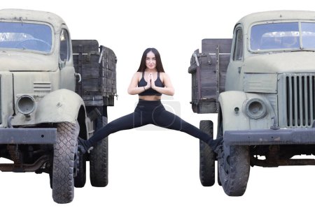 Photo for Girl doing the splits between military vehicles isolated on white, weapons - Royalty Free Image