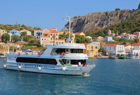 Photo for KASTELLORIZO,GREECE-AUGUST 10:Ferry with Unidentified Passengers leaving Kastellorizo Island. August 10,2018 in Kastellorizo, Greece - Royalty Free Image