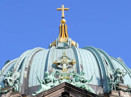 Rooftop Details of The Berlin Cathedral with Golden Cross and Blue Sky Background in Berlin, Germany