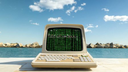Photo for Retro computer on a beach with data and code on screen - Royalty Free Image
