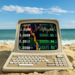 retro computer on a beach with stock and trading data and code on screen
