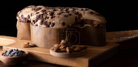 Colomba with chocolate. Easter Italian cake with almonds and chocolate in the shape of a dove. Festive pastries are traditional in Italy. 