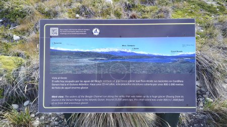 Photo for Tierra del fuego, Argetina; April 15 2022: Explanatory poster of andes mountains view from one of the island of tierra del fuego province, argentina - Royalty Free Image