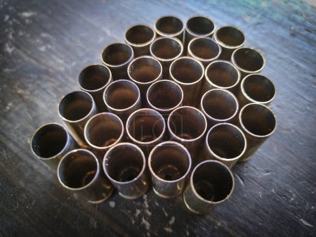 Top view shot grouped used shotgun cartridges over table