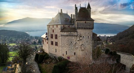 Téléchargez les photos : Most beautiful medieval castles of France - fairytale Menthon located near lake Annecy. aerial view - en image libre de droit