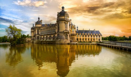 Photo for Great beautiful castles and heritage of France- Chateau de Chantilly over sunset - Royalty Free Image