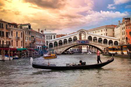 Photo for Romanic Venetian sunset over Grand canal and Rialto bridge. Venice , Italy.  june 2012 - Royalty Free Image